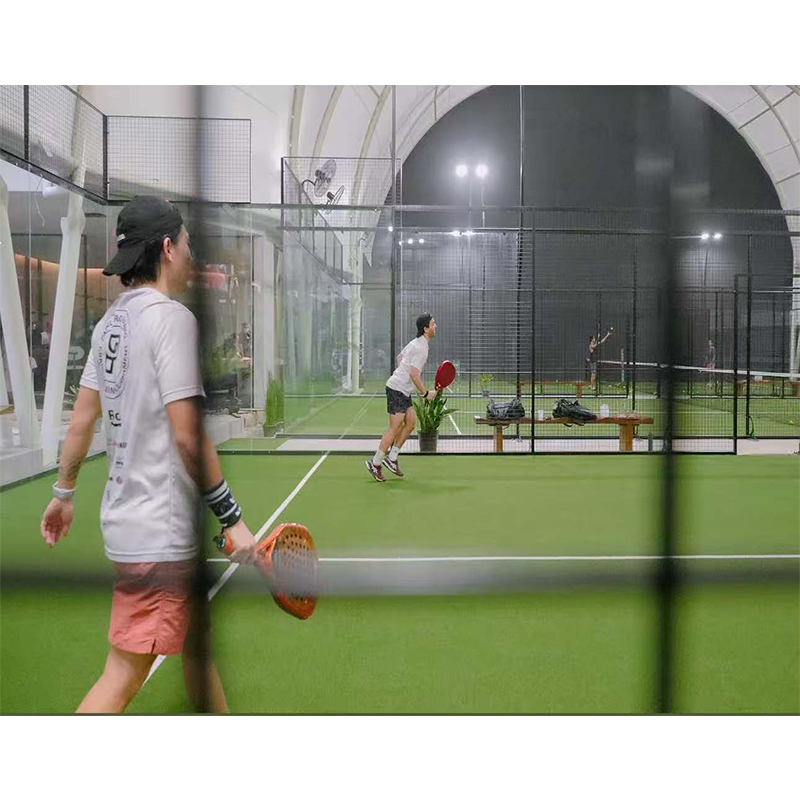 Indoor padel court beneath an arched sport roof cover